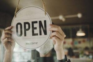 'Open/welcome' sign on a shop window