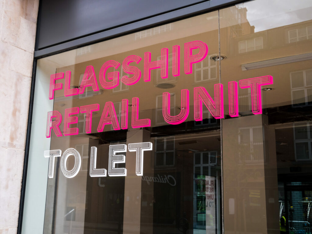 'Flagship retail unit to let' written on a shop window