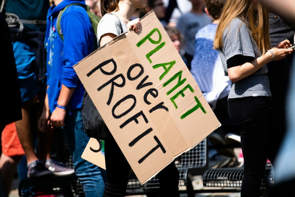 'Planet Over Profit' protest sign